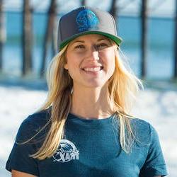 Headshot of Kelly Twichel on the beach wearing Access Trax merchandise